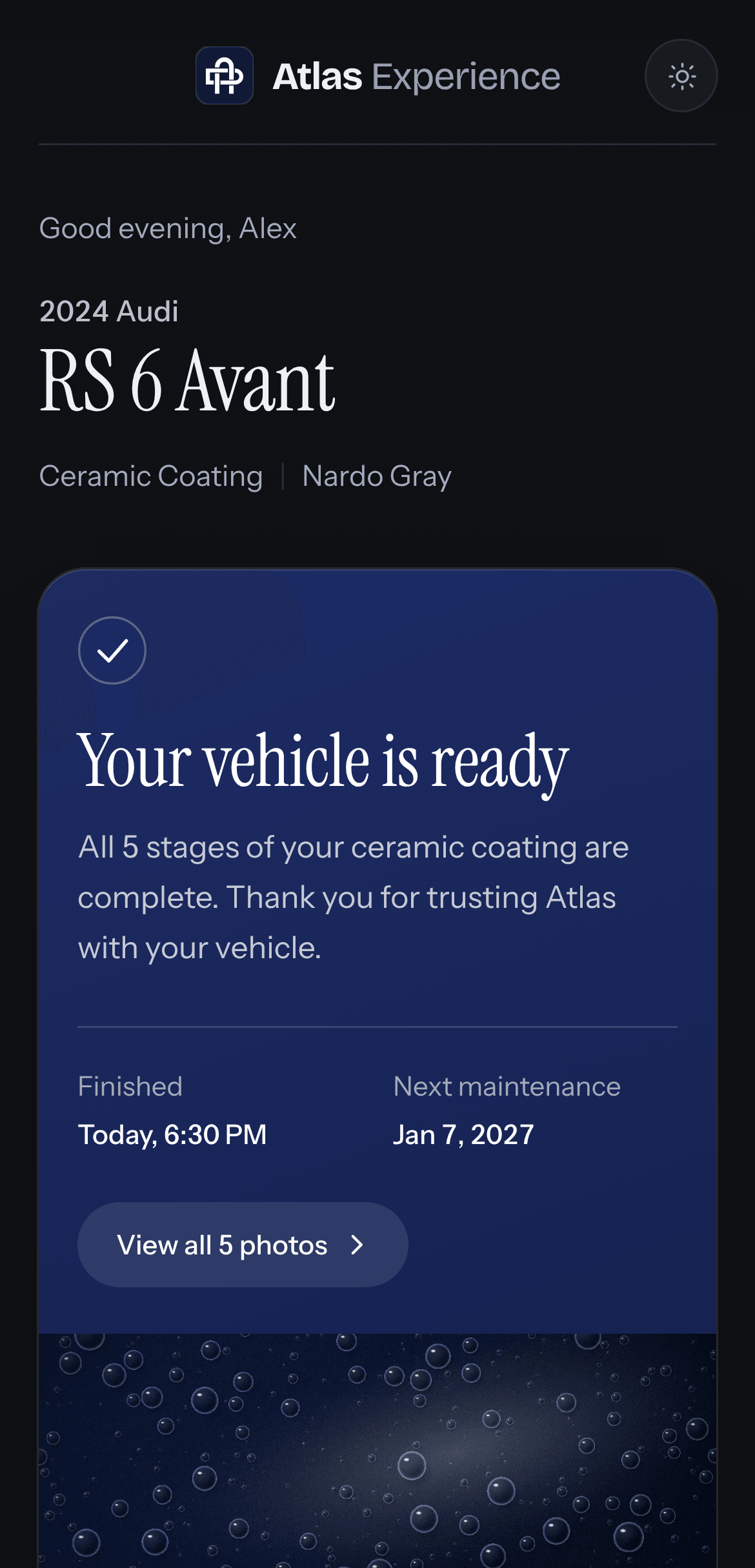 The Ready state in Dark Mode: “Your vehicle is ready”, with the finish time, next maintenance date and a button to view all photos.